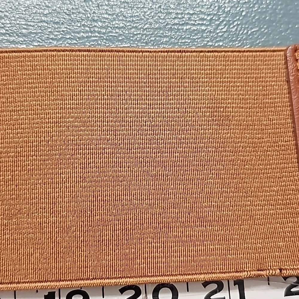 Stretch wide belt. There is some wear but picked it‎ up because it is cut…